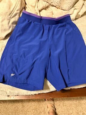 Fabletics Blue Athletic Shorts with Purple Waistband - linerless